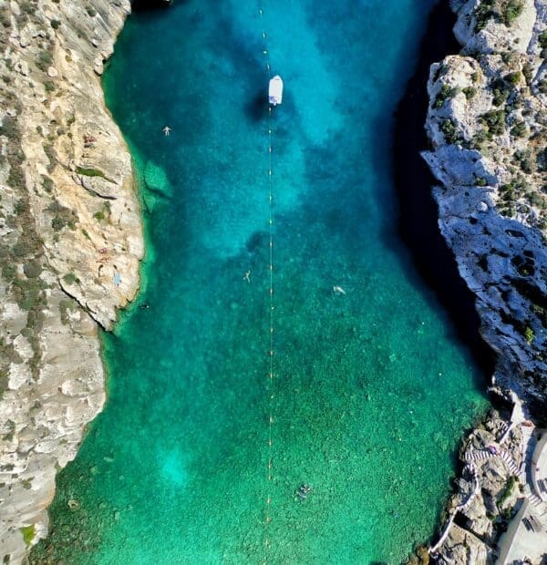 Stunning aerial view of the Blue Hole and Inland Sea in Gozo, Malta. This iconic scuba diving destination is renowned for its crystal-clear waters, unique geological formations, and vibrant marine life. Perfect for both beginner and experienced divers, Gozo offers an unforgettable underwater adventure. Plan your trip now and dive into the beauty of the Mediterranean!