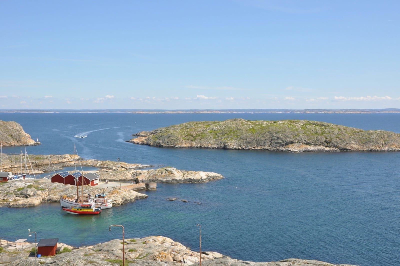 Scenic coastal view with boats and rocky islands