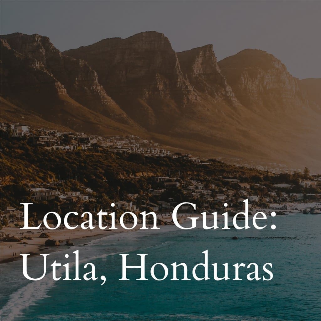 Seaside town beneath mountain, Utíla, Honduras guide cover