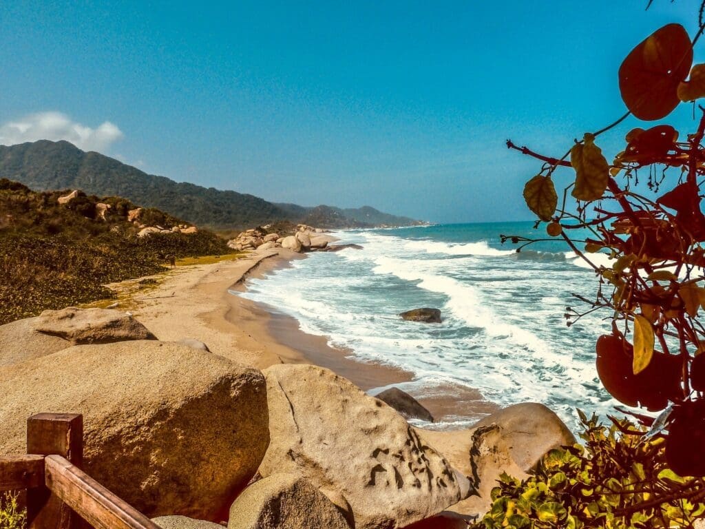 Scenic coastal view with sandy beach and rocky shore