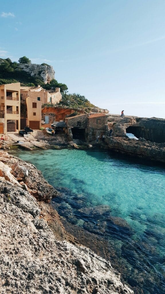 Coastal Mediterranean village with clear turquoise waters