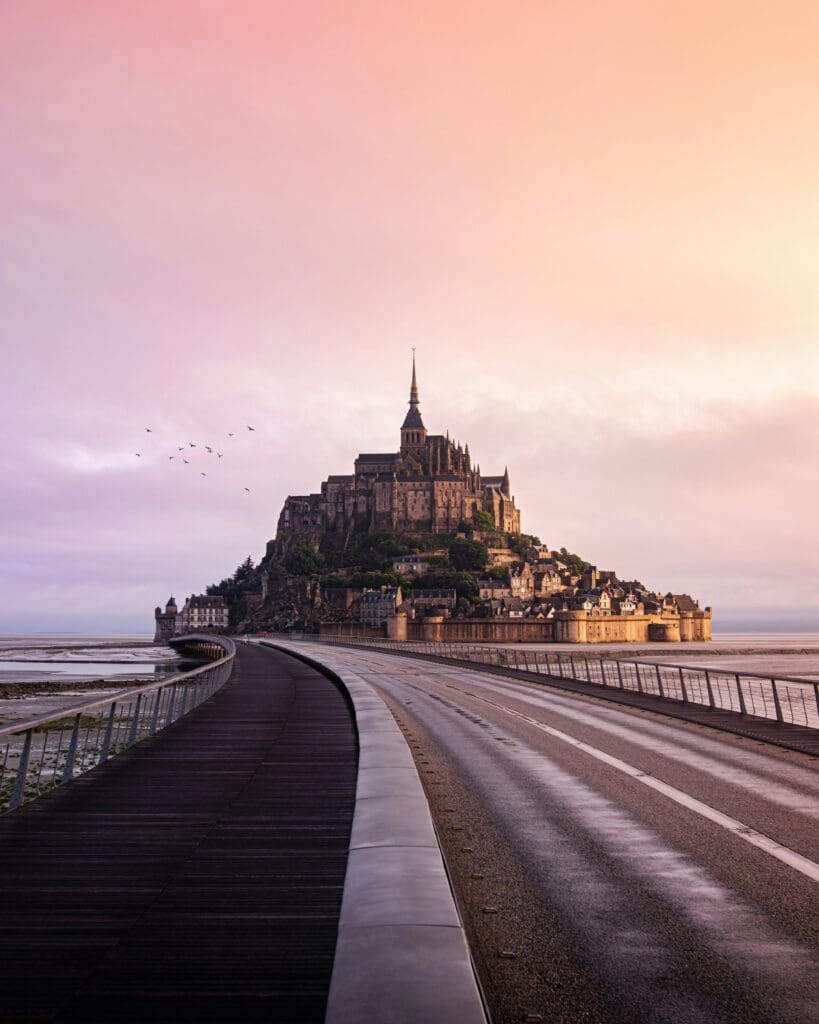 Mont Saint-Michel at sunrise with colorful sky