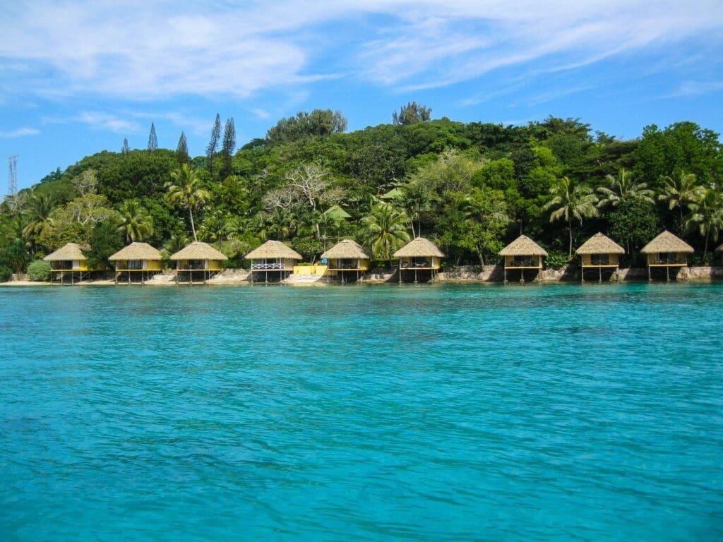 Tropical island with overwater bungalows and lush greenery