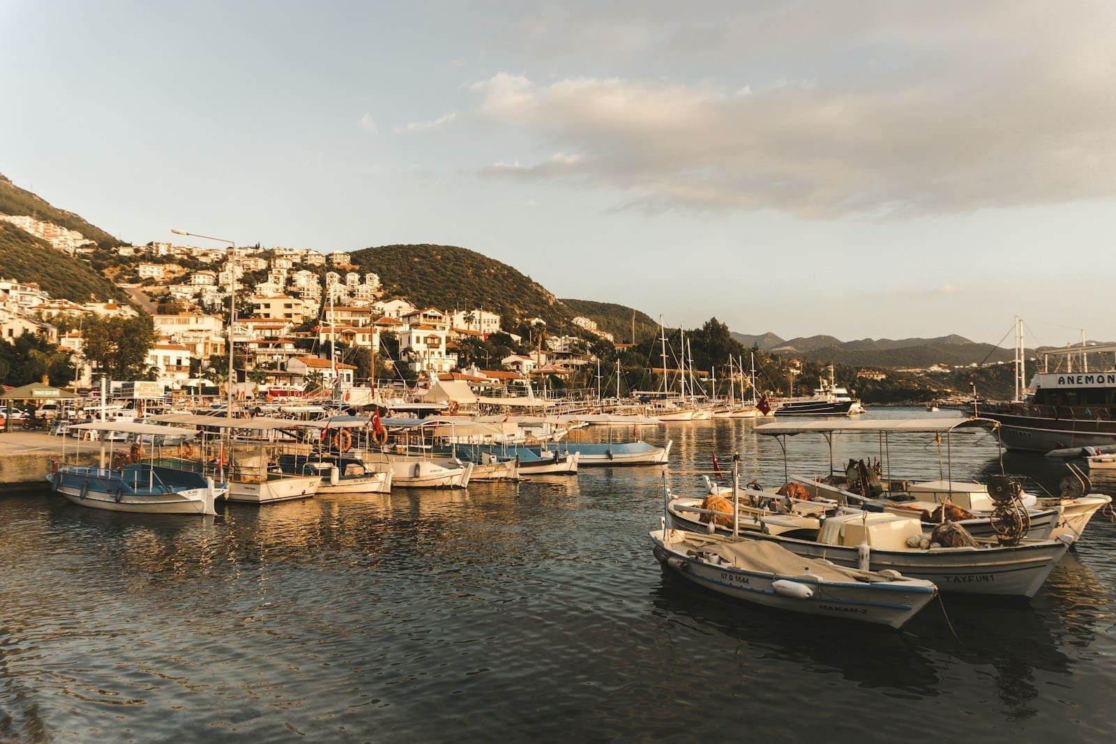 a group of boats floating on top of a body of water